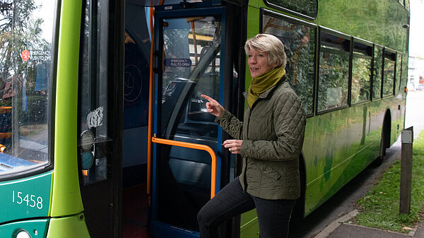 Pippa Heylings stepping on to a bus