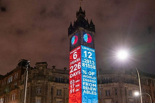 A clock tower showing the time and the amount of time remaining for the world leaders to meet agreed climate targets