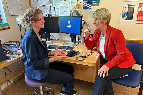 Pippa speaking with a GP in South Cambs surgery.