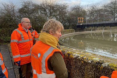 Pippa Heylings watching sewage overflow in action from storm tank with Robin Price, Director of Environment and Water Quality, Anglian Water