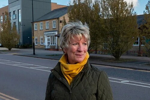 Pippa Heylings beside a road on one of the new housing developments in South Cambs