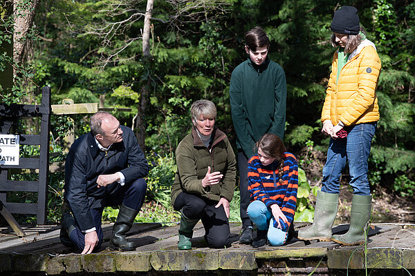 Pippa teaching children about biodiversity with Ed Davey
